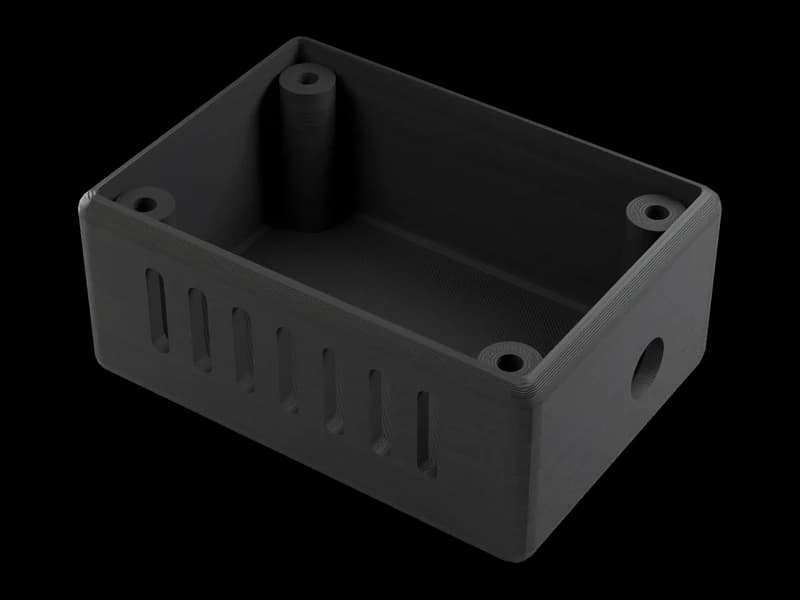 Render of an open black PETG electronics enclosure with vent slots and screw bosses, printed layers visible