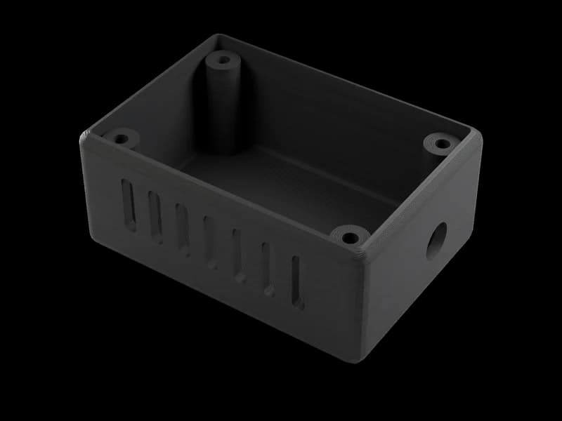 Render of a larger open black PETG electronics enclosure with vent slots, printed layers visible