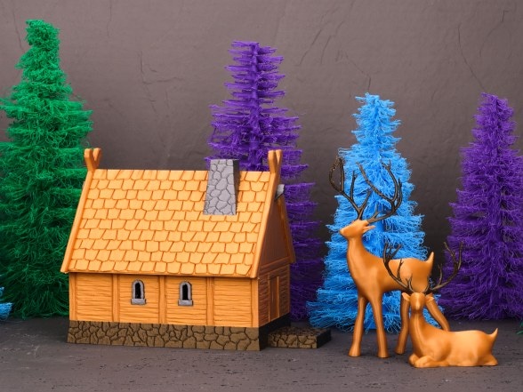 A PLA model cottage with a tiled roof, two deer and textured trees